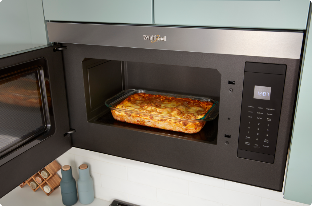Inside a Whirlpool Over-the-Range Microwave with a flush design is a casserole