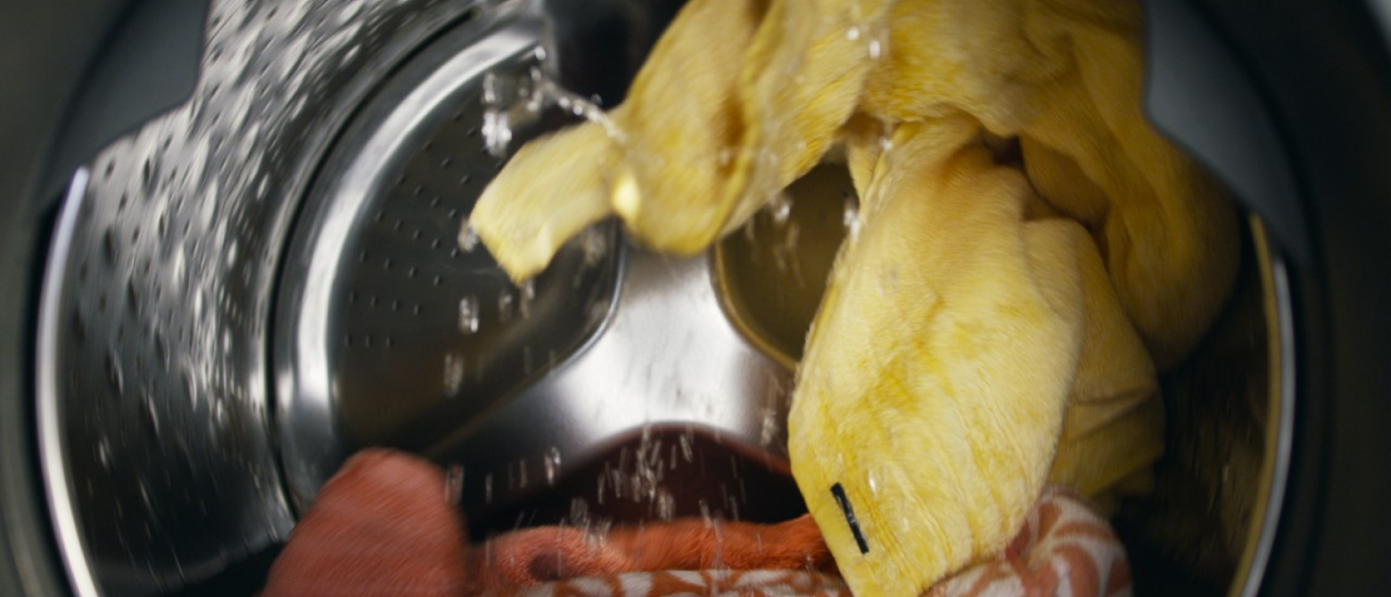 Towels being washed in a washing machine.