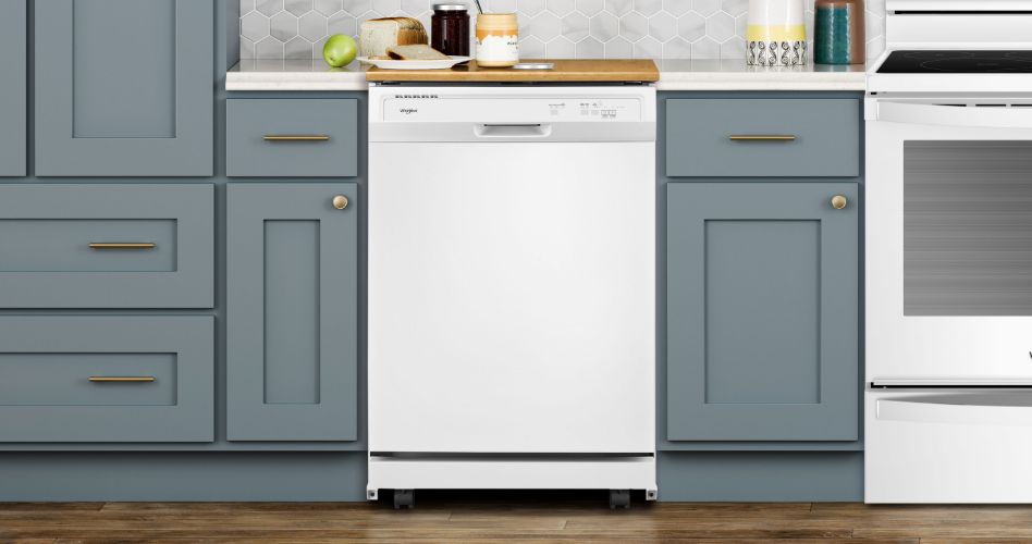 A kitchen with a Whirlpool dishwasher and a Whirlpool oven. They are surrounded by grey cabinets and drawers.