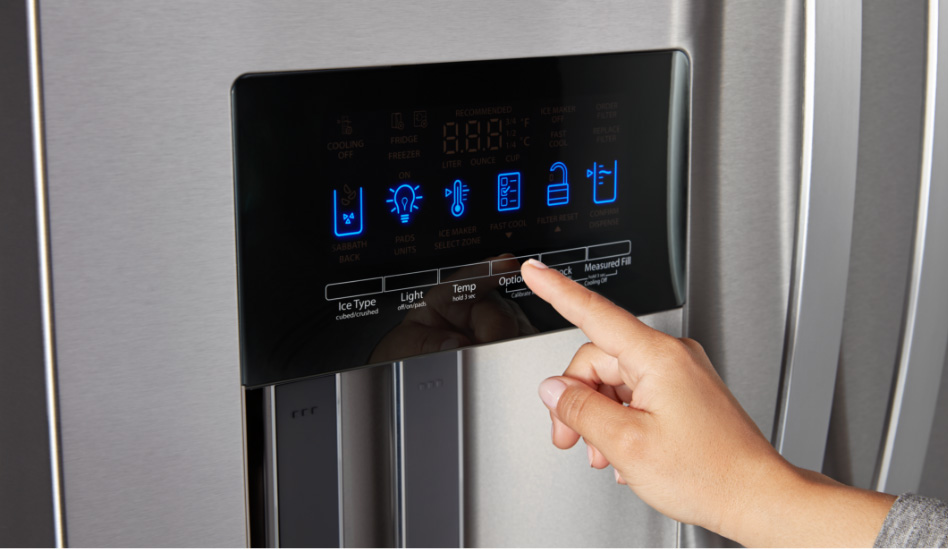 Whirlpool Combination Microwave A homeowner is seen using the tap touch controls on a Whirlpool refrigerator