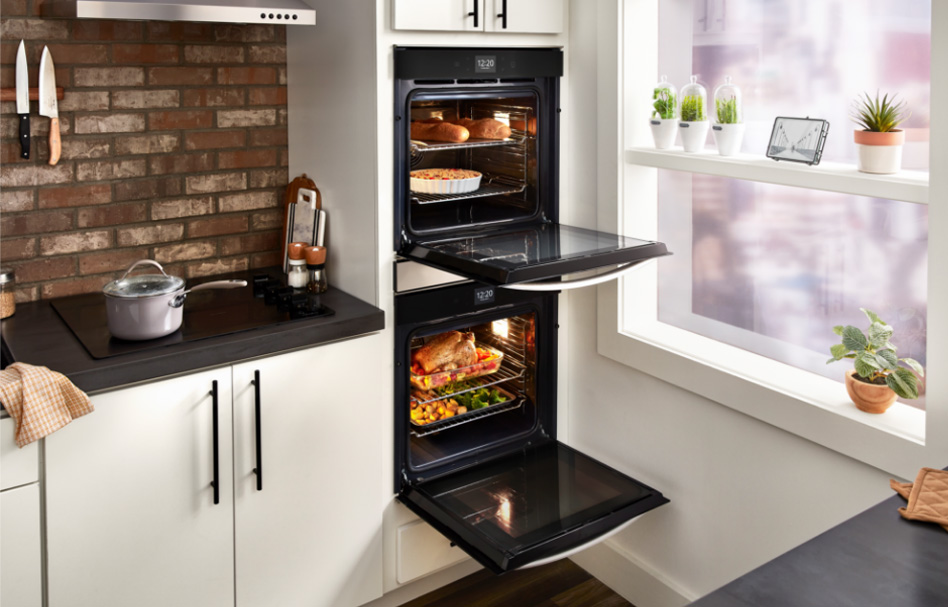 Whirlpool Combination Microwave Food is seen inside of a black double oven