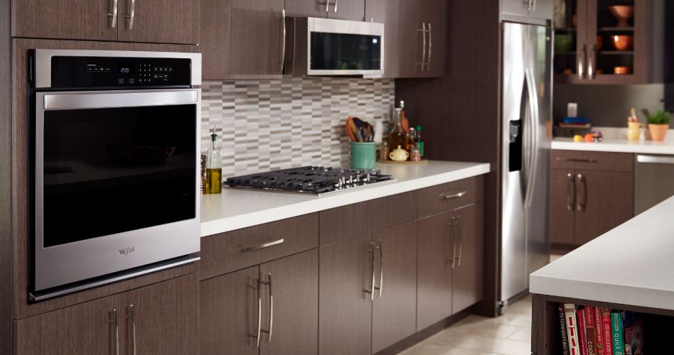 A modern kitchen without various stainless steel Whirlpool built in appliances