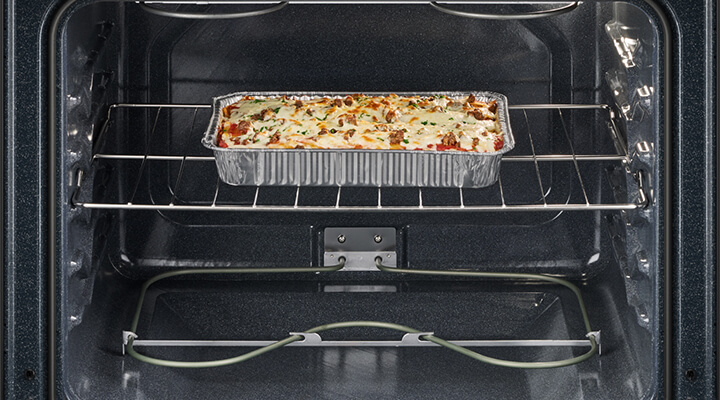 A Whirlpool® Oven with lasagna baking inside A Whirlpool® Oven with lasagna baking inside