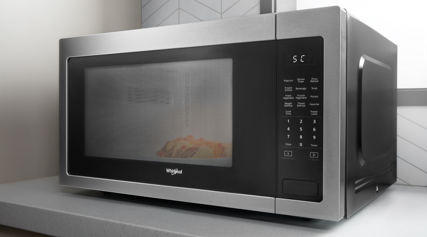 Whirlpool® Countertop Microwave on white countertop Whirlpool® Countertop Microwave on white countertop