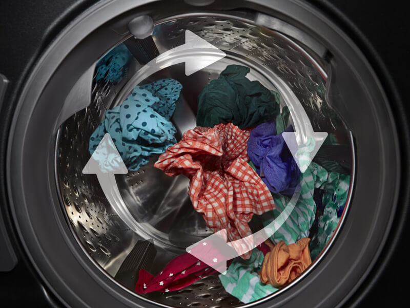 Open washer with arrows showing tumbling action
