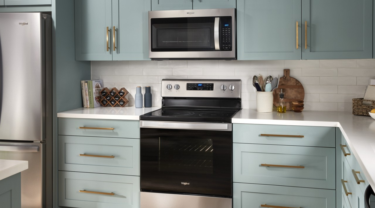 Whirlpool® Stainless Steel Over-the-Range Microwave above Stainless Steel Whirlpool® Electric Cooktop
