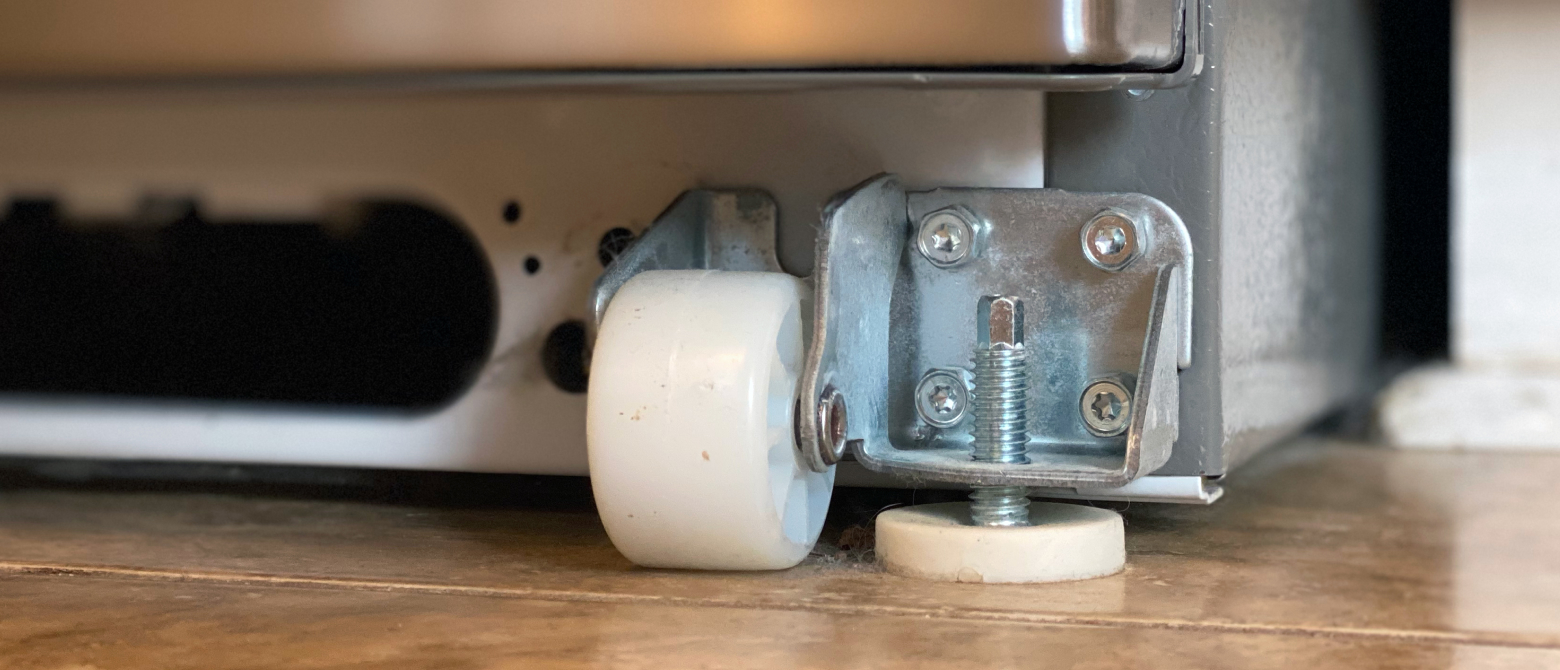 Refrigerator wheel and leveling leg