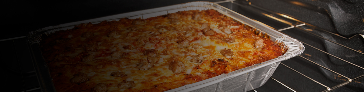 Lasagna cooking in an oven