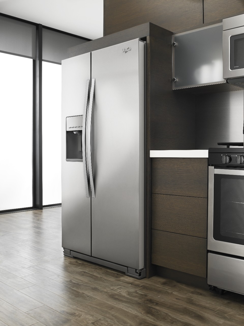 A stainless steel refrigerator in a modern kitchen.