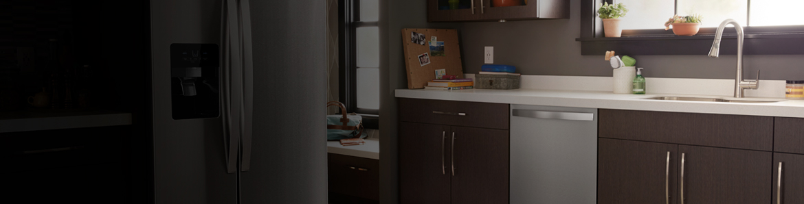Image of a modern kitchen displaying a stainless steel french-door refrigerator and dishwasher.
