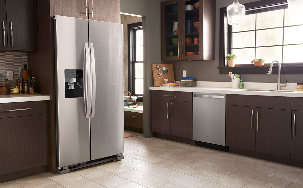 Image of a modern kitchen displaying a stainless steel french-door refrigerator and dishwasher.