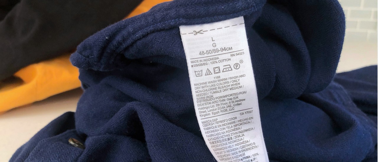 Clothing care label on a blue shirt