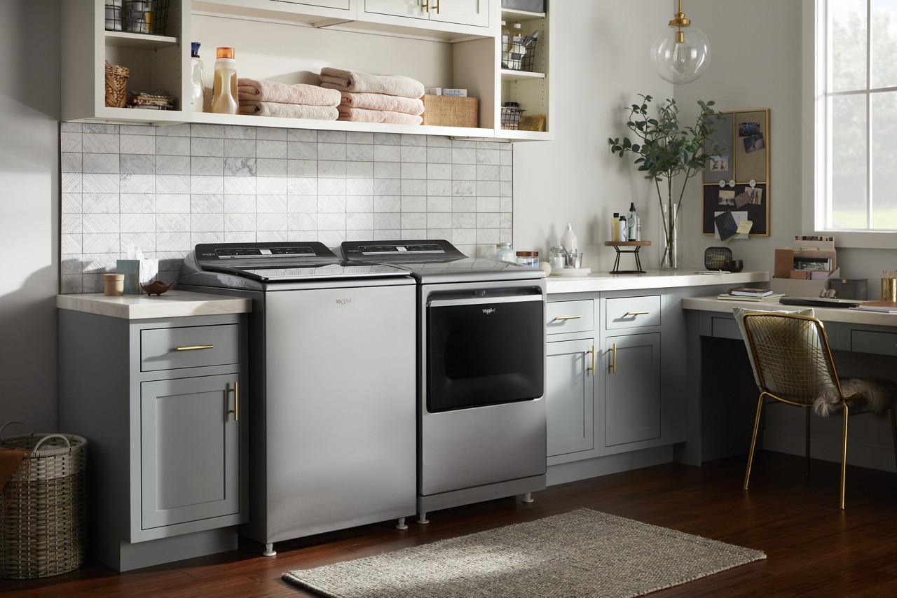 A side-by-side washer and dryer set in a laundry room. A side-by-side washer and dryer set in a laundry room.