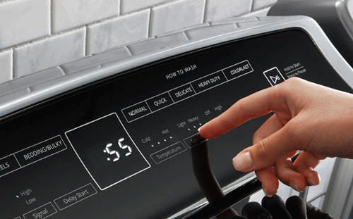 Pretreat stains with Whirlpool® top load laundry