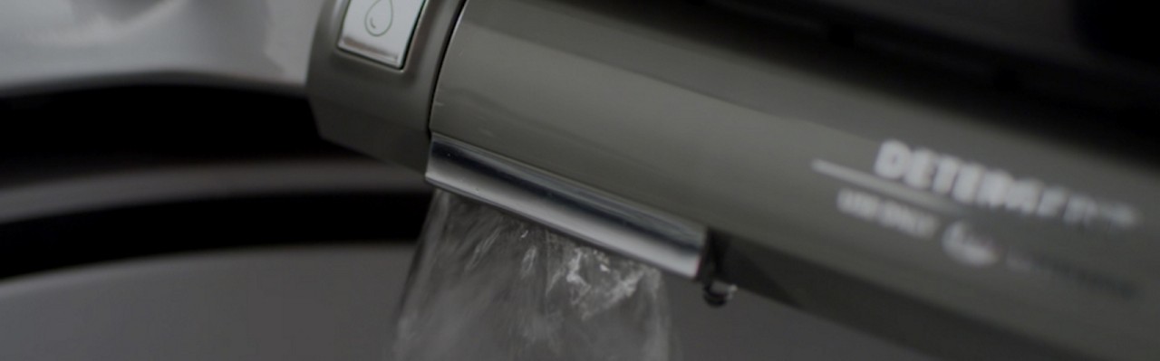 Pretreat stains with an in-washer faucet