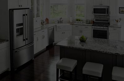 An image of a kitchen with text overlay that reads 'Extended Maintenance Service Programs' and 'Learn More'