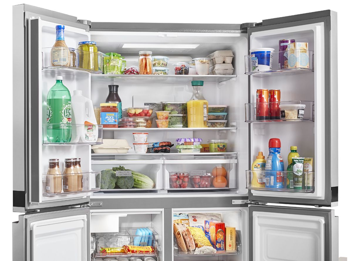 Whirlpool side-by-side refrigerator with open doors.