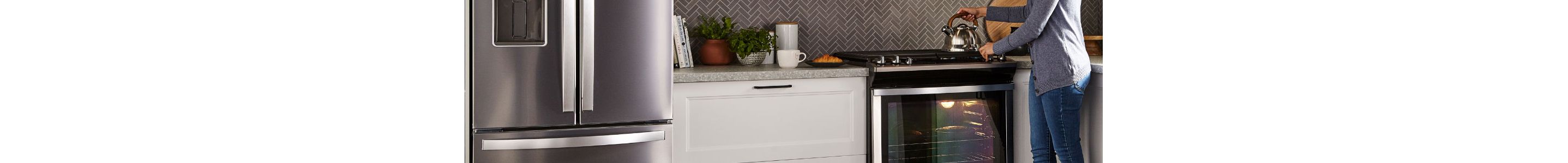 woman using Whirlpool range. 