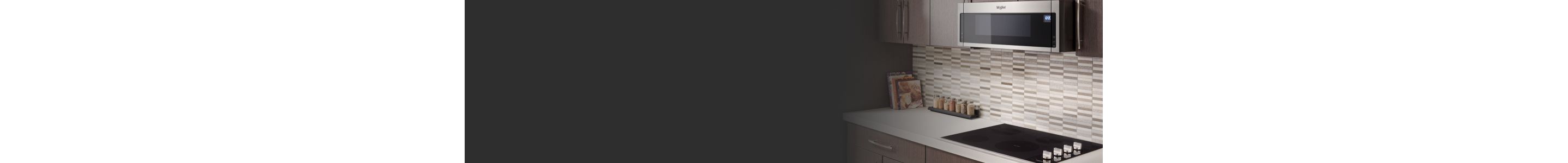 A banner image contrasting stainless steel with black and white kitchen appliances.