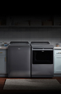 A Whirlpool® Side-by-Side Refrigerator installed within teal cabinets