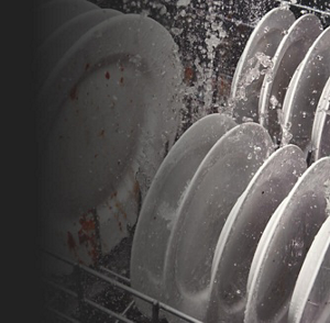 Dishes being washed in dishwasher