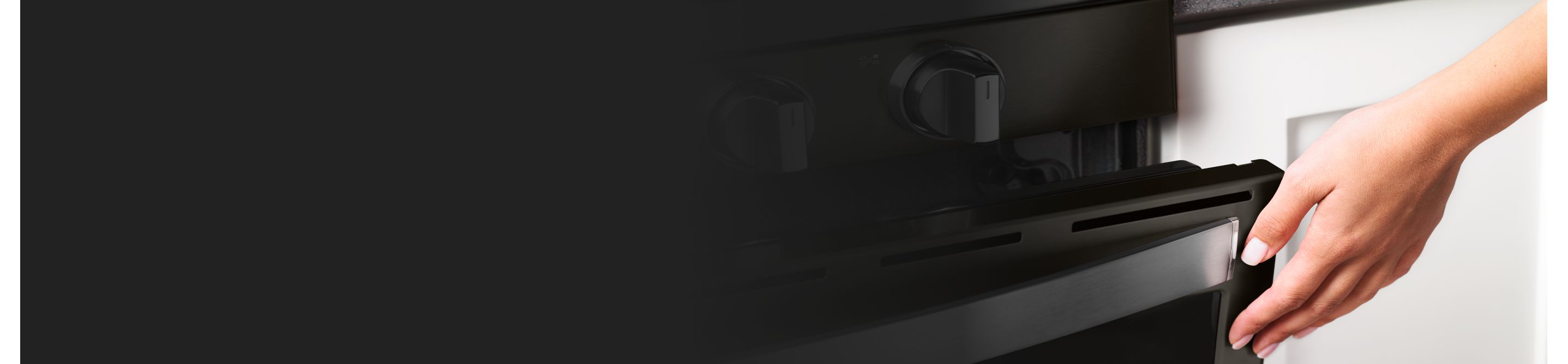 Gas range cooktop knobs and open oven door