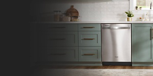  A Whirlpool® Dishwasher surrounded by teal cabinetry