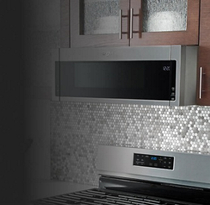 Whirlpool® Microwave set in brown cabinetry